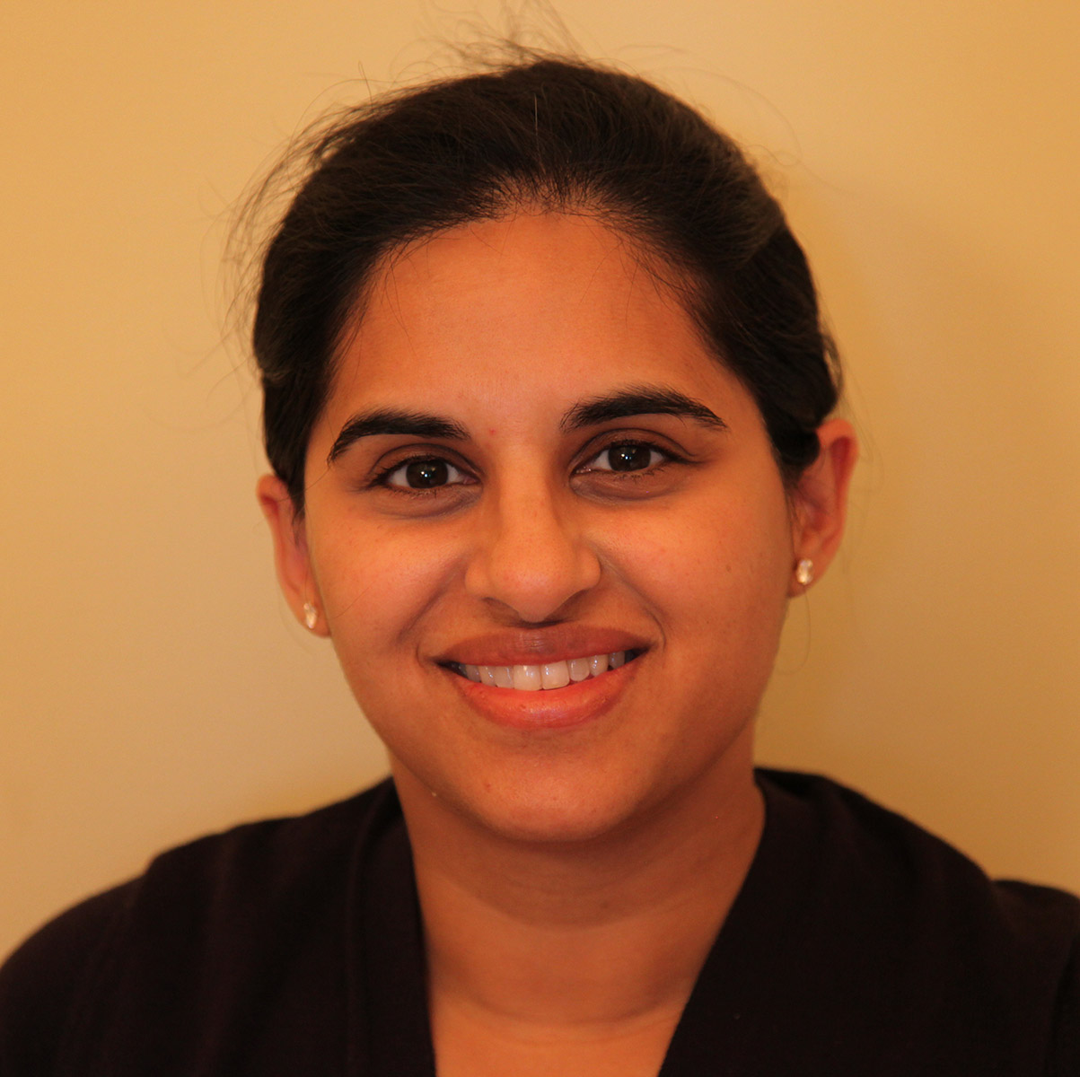 Headshot of Dr Khami Satchi